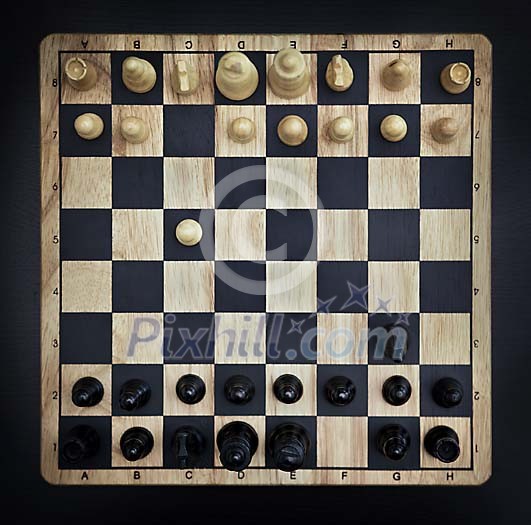 Chess opening on a chessboard