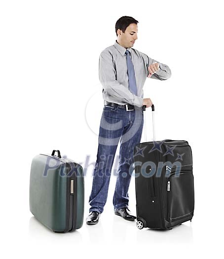 Clipped man with suitcases looking at the watch