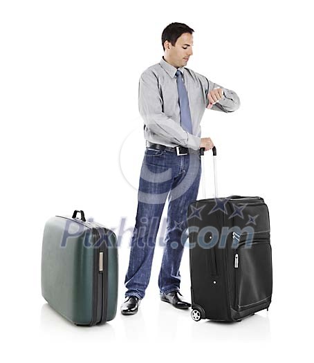 Clipped man with suitcases looking at the watch Clipped man with suitcases looking at the watch