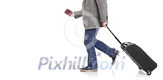 Clipped man walking with a suitcase and a passport in his hand