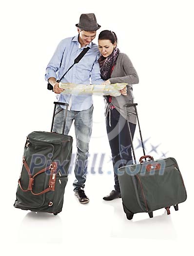 Clipped couple with suitcases looking at the map