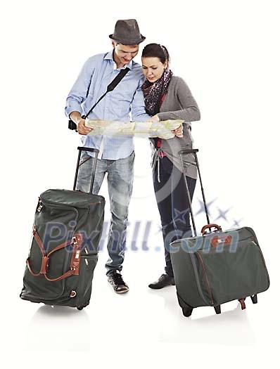 Clipped couple with suitcases looking at the map Clipped couple with suitcases looking at the map