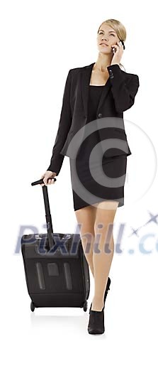 Clipped businesswoman with a suitcase and mobile phone