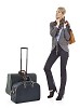 Clipped businesswoman standing next to her luggage