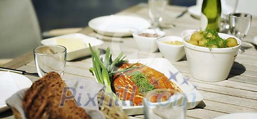 Smoked salmon and new potatoes served outside Smoked salmon and new potatoes served outside