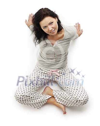 Woman sitting on the floor looking up Woman sitting on the floor looking up