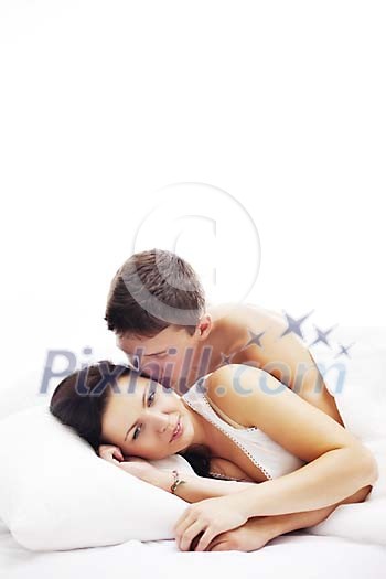 Couple in the bed, man kissing woman
