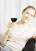 Woman sitting with a glass of red wine