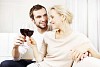 Couple sitting on the couch having a glass of wine