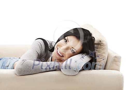 Isolated woman smiling on the sofa