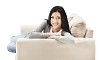 Isolated woman on the couch smiling to the camera