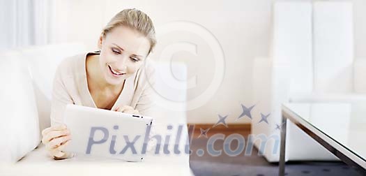 Woman on the couch with tablet