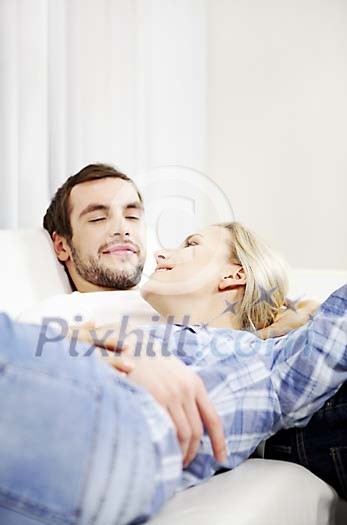 Couple on the couch relaxing Couple on the couch relaxing