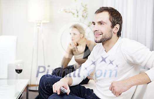 Couple at home watching tv Couple at home watching tv