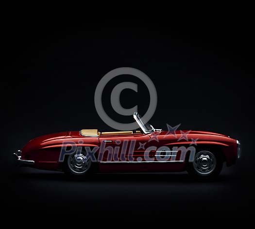 Convertible vintage car on a black background Convertible vintage car on a black background