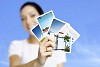 Woman showing vacation photographs