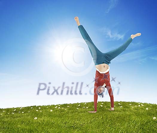 Woman on the grass upside down