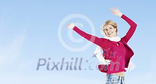 Woman juping under the blue sky