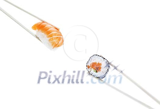 Isolated sushi pieces with chopsticks