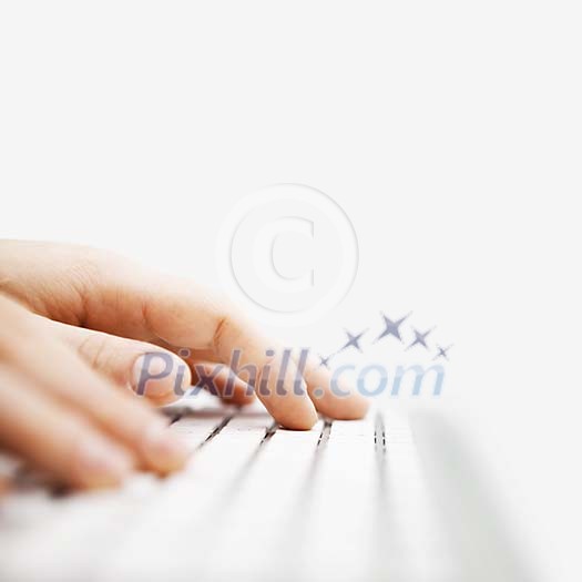 Fingers typing on the keyboard