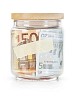 Isolated glass jar filled with paper money