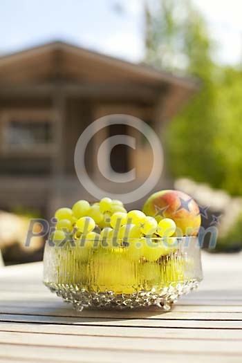 Sun  shining on a bowl of fruits
