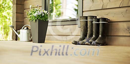 Boots and flowers on the porch