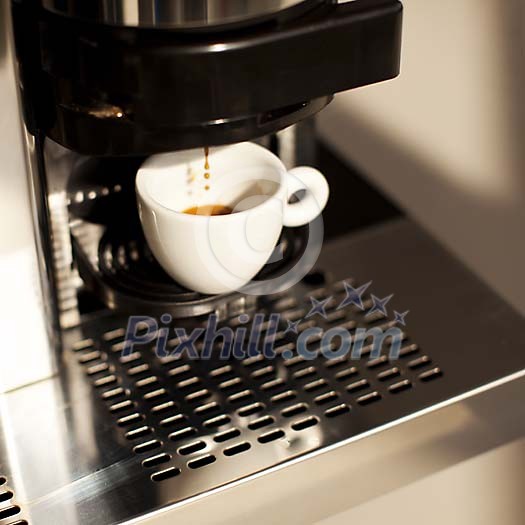 Cup of coffe being made on the machine