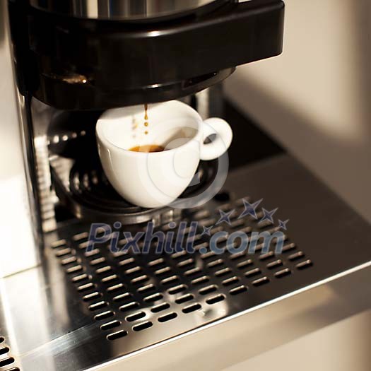 Cup of coffe being made on the machine Cup of coffe being made on the machine