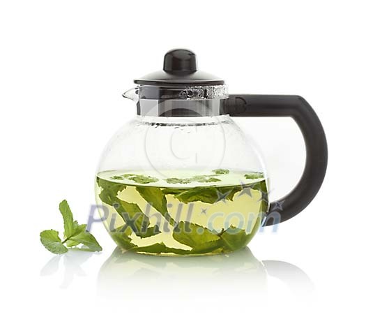 Isolated pot of fresh peppermint tea