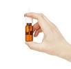 Isolated hand holding a nasal spray