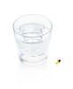 Isolated glass of water with a pill