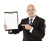 Isolated man pointing to a blank paper