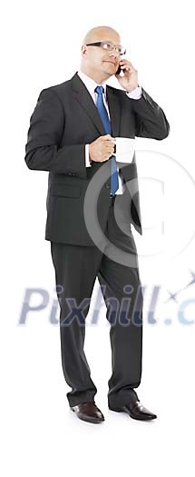 Isolated businessman drinking coffi and talking to the phone