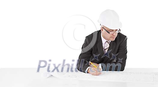 Man holding a pen and leaning over a blueprint