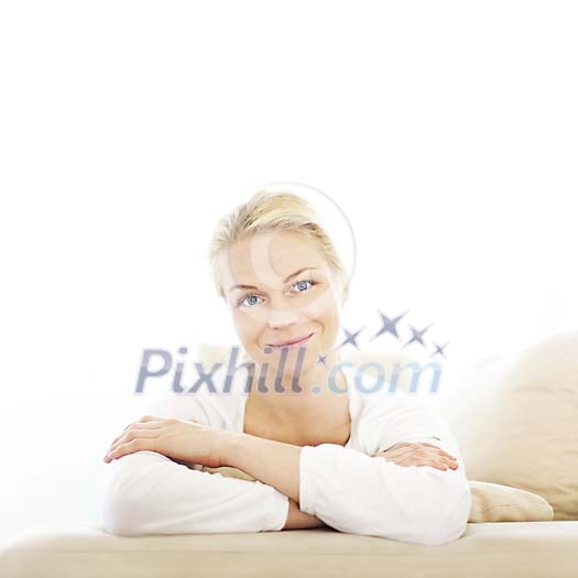 Woman on the couch smiling to the camera