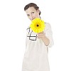 Isolated woman holding a yellow gerbera