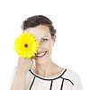 Isolated woman holding a flower in front of her eye