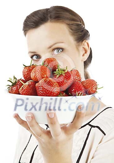Woman holding a bowl of strawberries