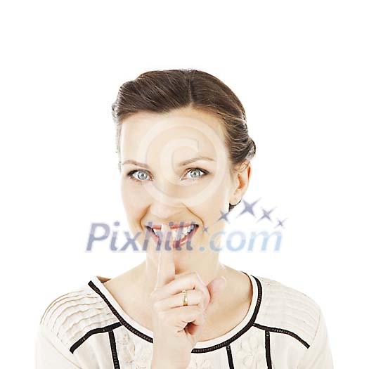 Isolated woman holding her finger infront of her mouth Isolated woman holding her finger infront of her mouth
