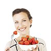 Isolated woman starting to eat strawberries