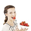 Isolated woman biting a strawberry
