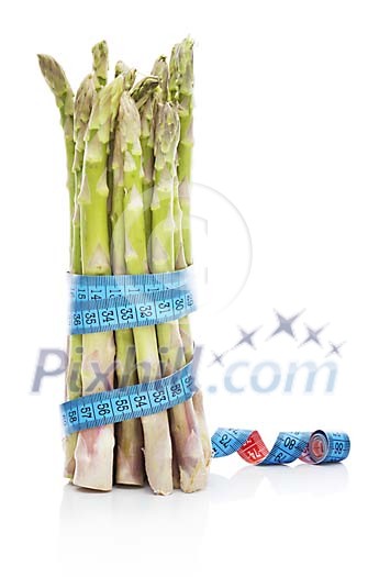 Isolated bunch of asparagus with a tapeline around it