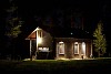 Lighted cottage in the dark night