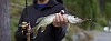 Man holding a pike in his hand