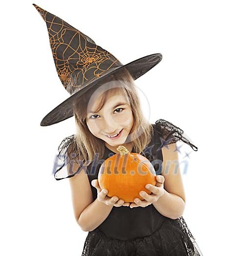 Girl dressed as a witch offering a pumpkin