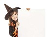 Girl dressed as a witch holding a blank card