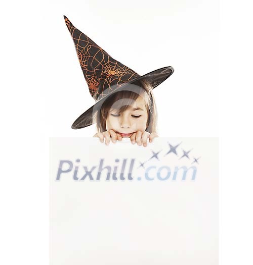 Girl with a witch hat holding a blank card