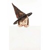 Girl with a witch hat holding a blank card