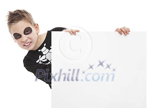 Boy dressed as a skeleton holding a blank card